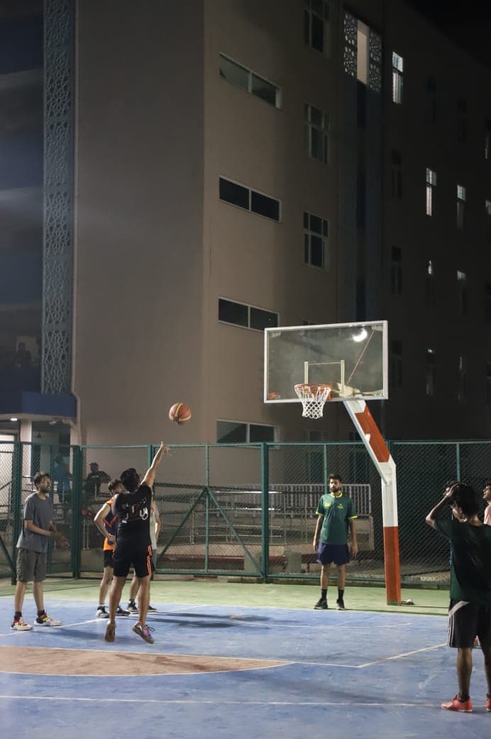 Taking a shot in basketball at IIT Jammu